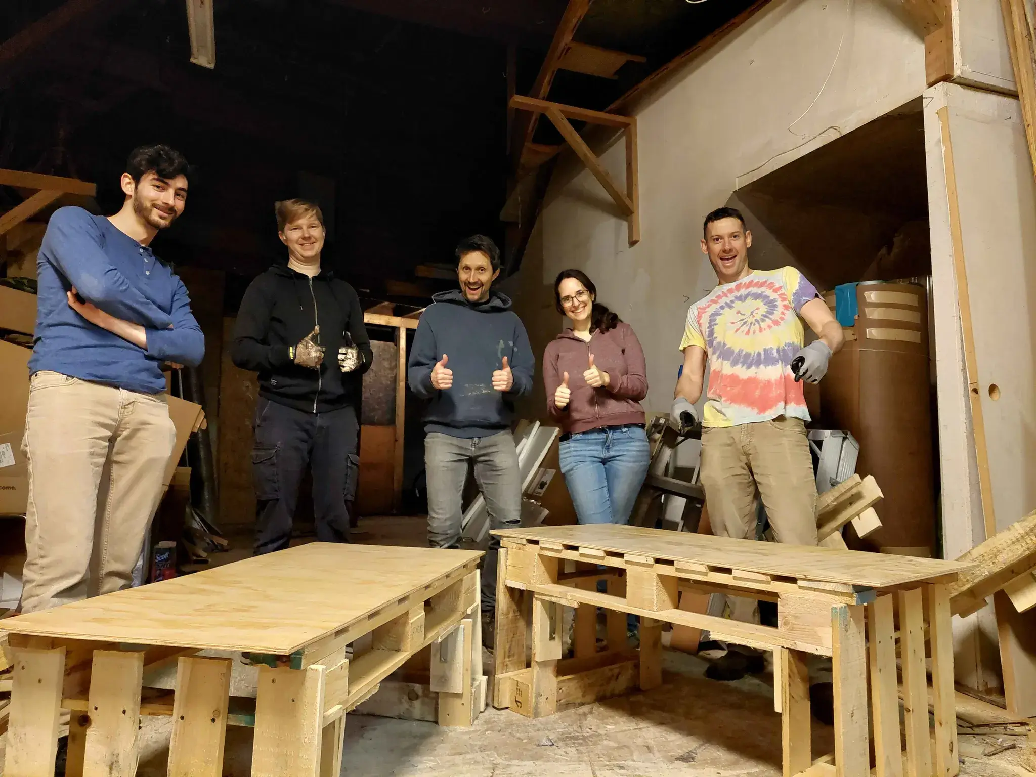 Strong Towns Vancouver volunteers with their repurposed wooden shipping pallets converted into public benches.